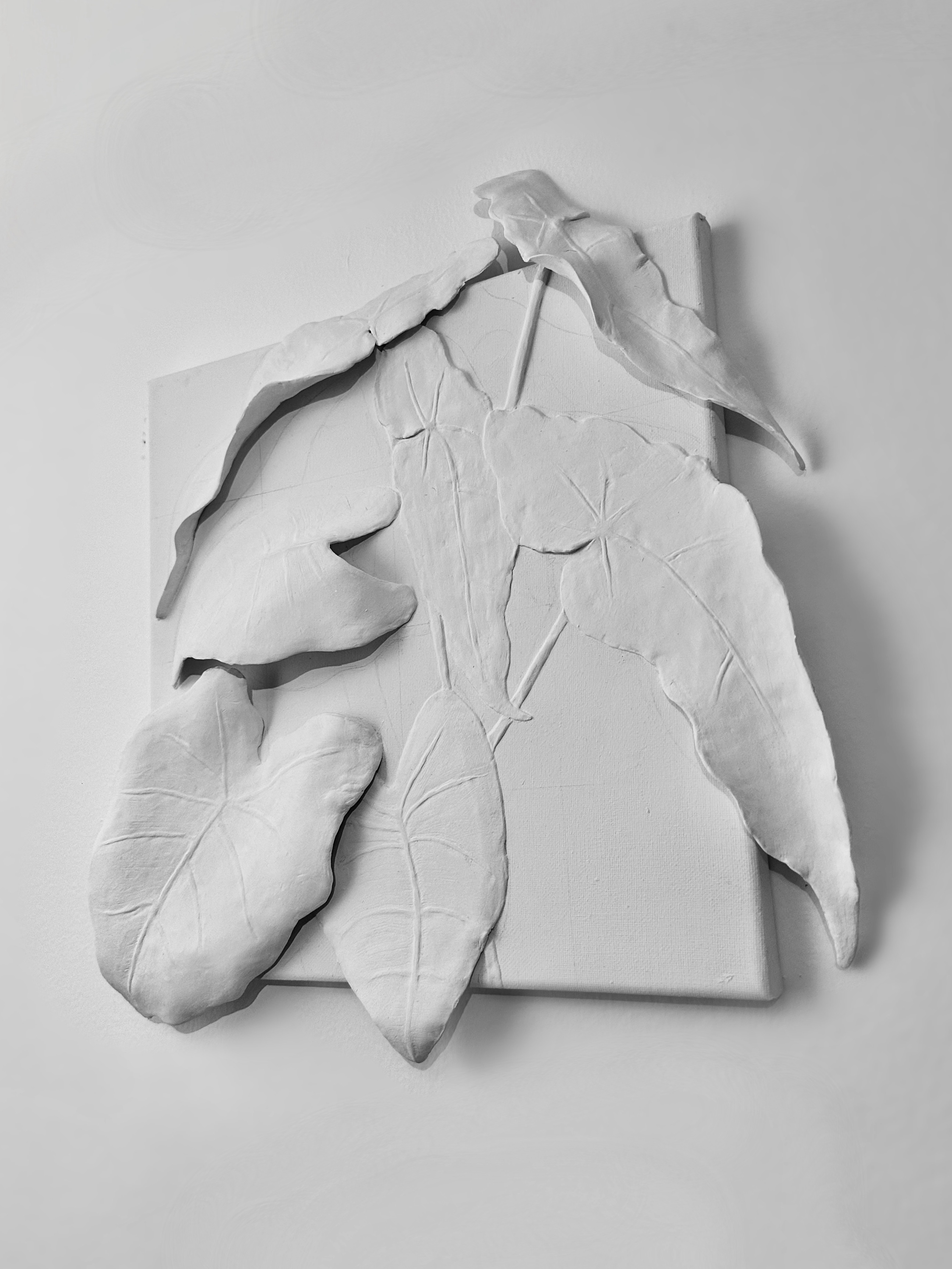 White ceramic plant sculpture